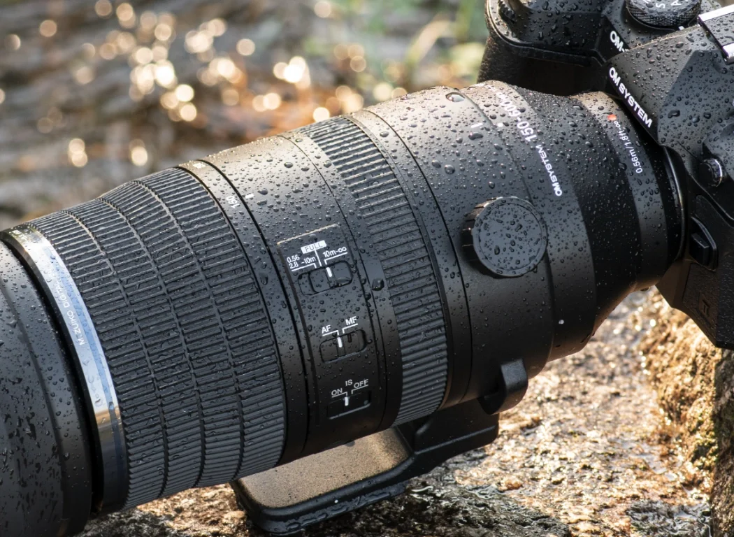 Detailed view of the super telephoto zoom lens with raindrops on it